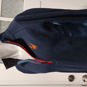 Spyder men's navy blue zip pullover with orange detailing. Medium